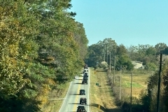 line-of-jeeps-going-up-mountain-hill